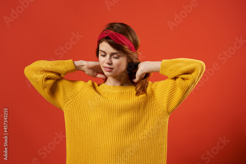pretty woman in yellow sweater blue glasses fashion hairstyle