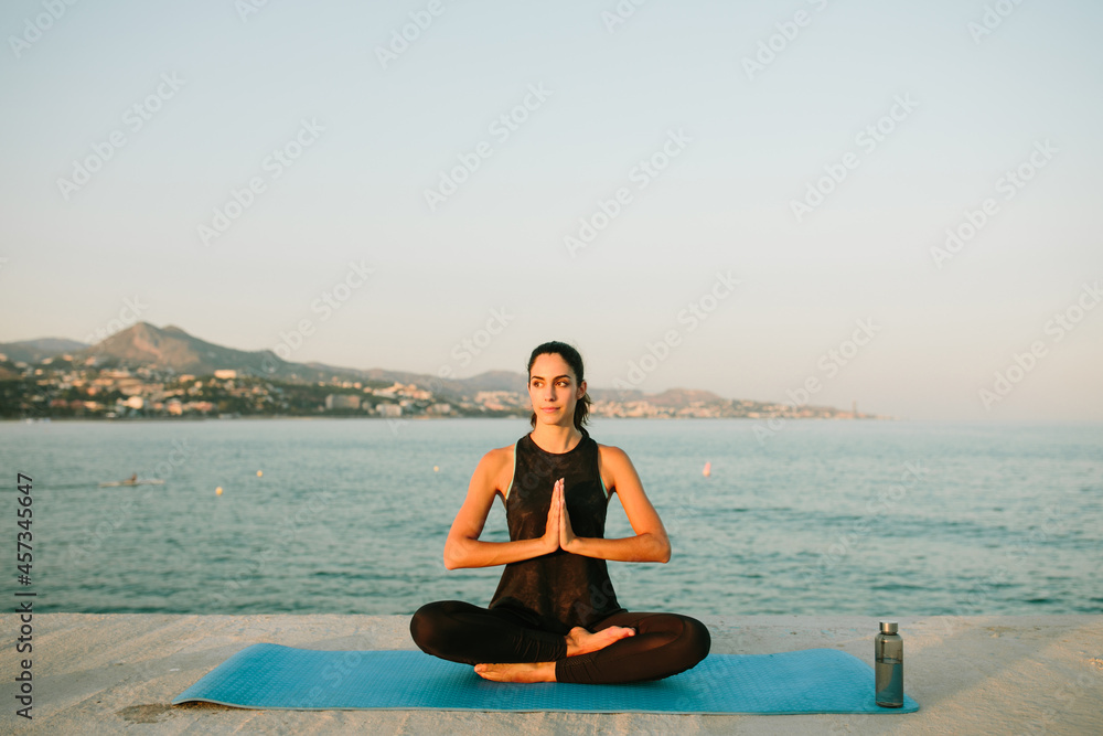 Flexible woman meditating in Lotus pose Flexible woman meditating in Lotus pose