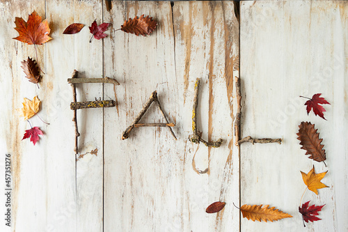 Fall rustic title with a frame full of autumn natural stuff on a white wooden background