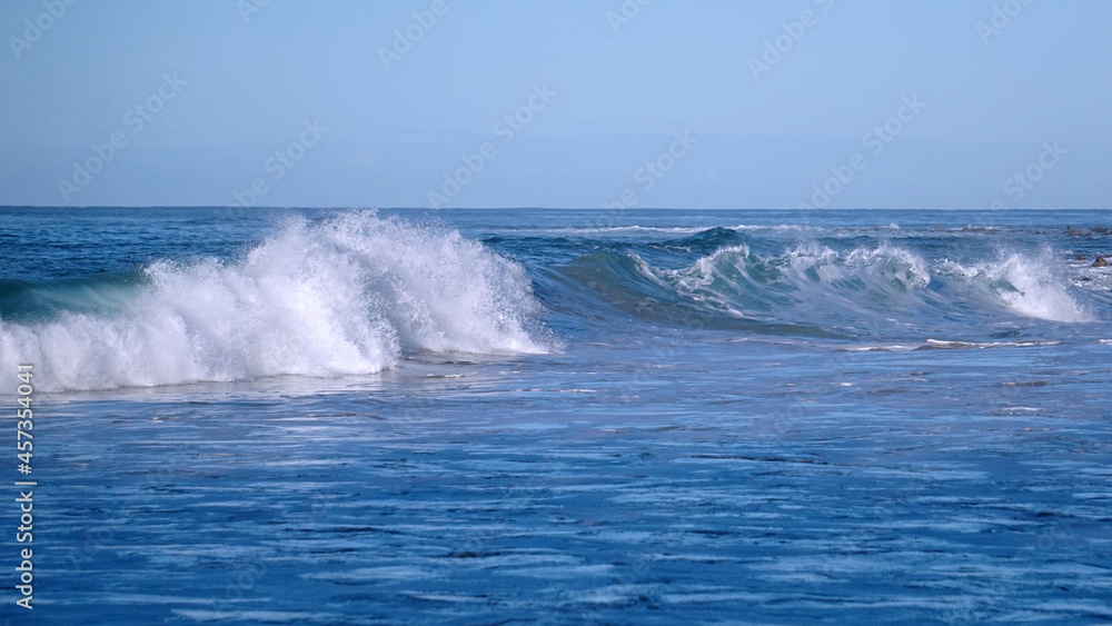 Breaking waves in the Pacific Ocean off the coast of Kauai
