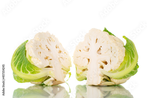 Two halves of fragrant organic cauliflower, close-up, isolated on white.
