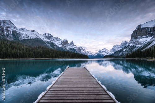 Spirit Island with wooden pier and Canadian Rockies on Maligne lake at Jasper national park, Canada