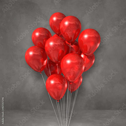 Red balloons bunch on a grey wall background