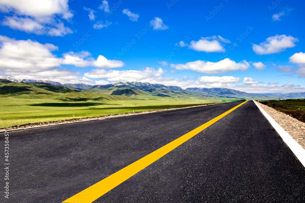 Fototapeta premium Tarmac road under blue sky