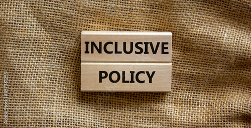 Inclusive policy symbol. Wooden blocks with words Inclusive policy on beautiful canvas background. Business, HR and inclusive policy concept. Copy space. photo