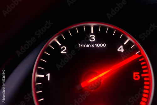 Dashboard with speedometer, tachometer, odometer. Car detailing. Car dashboard. Dashboard details with indication lamps.Car instrument panel.Modern interior.Close up shot.Blurred image.