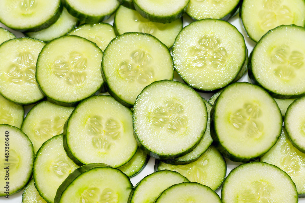 Fresh Green Cucumber and slices nice background. Fresh Green Cucumber and slices nice background.