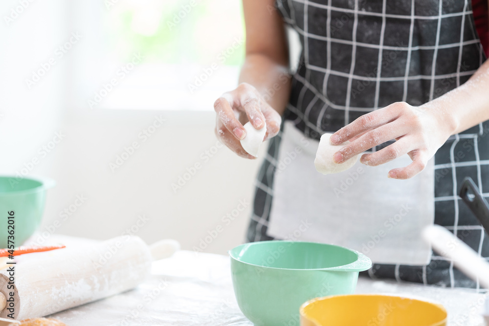 close up chef hands cracking fresh egg yolk and dropping in a bowl close up chef hands cracking fresh egg yolk and dropping in a bowl