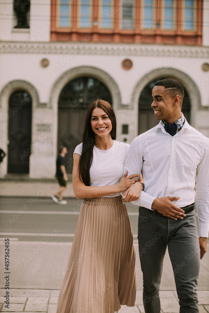 Young multiethnic couple walking on the street