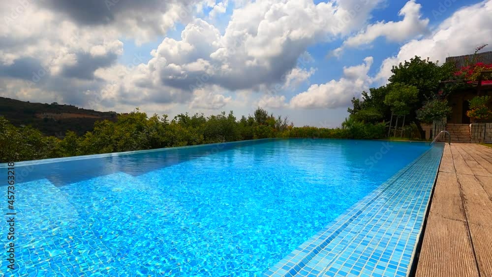 Infinity pool in cloudy weather time lapse. Summer season Infinity pool in cloudy weather time lapse. Summer season