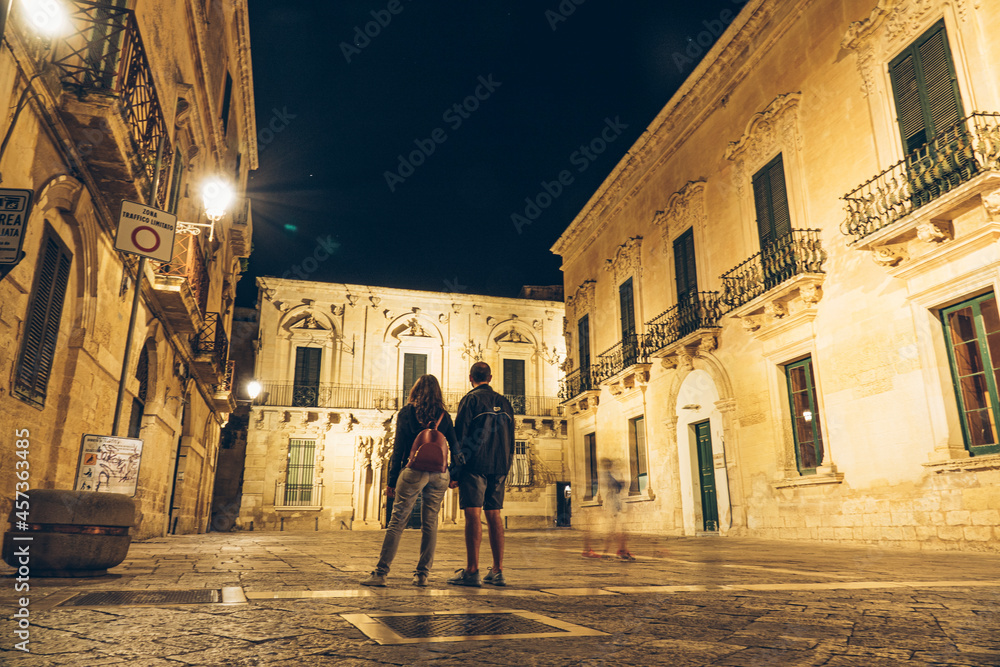 Lecce, walking down the old town by night in summer