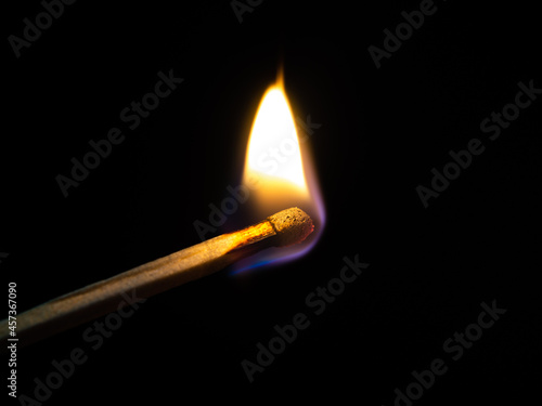 burning match on black background