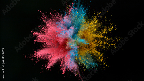 Fotografija Freeze motion shot of color powder explosion isolated on black background, close-up