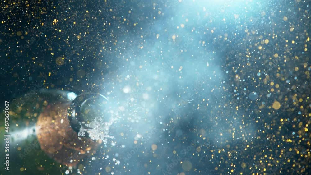 Super slow motion of Champagne explosion with glittering particles. Filmed on high speed cinema camera, 1000fps