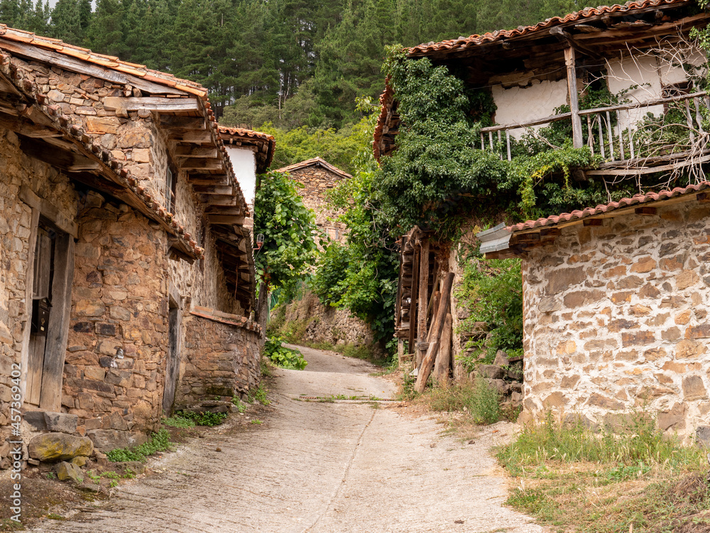 Beautiful entrance with aged stone and wood houses of a rural mountain village