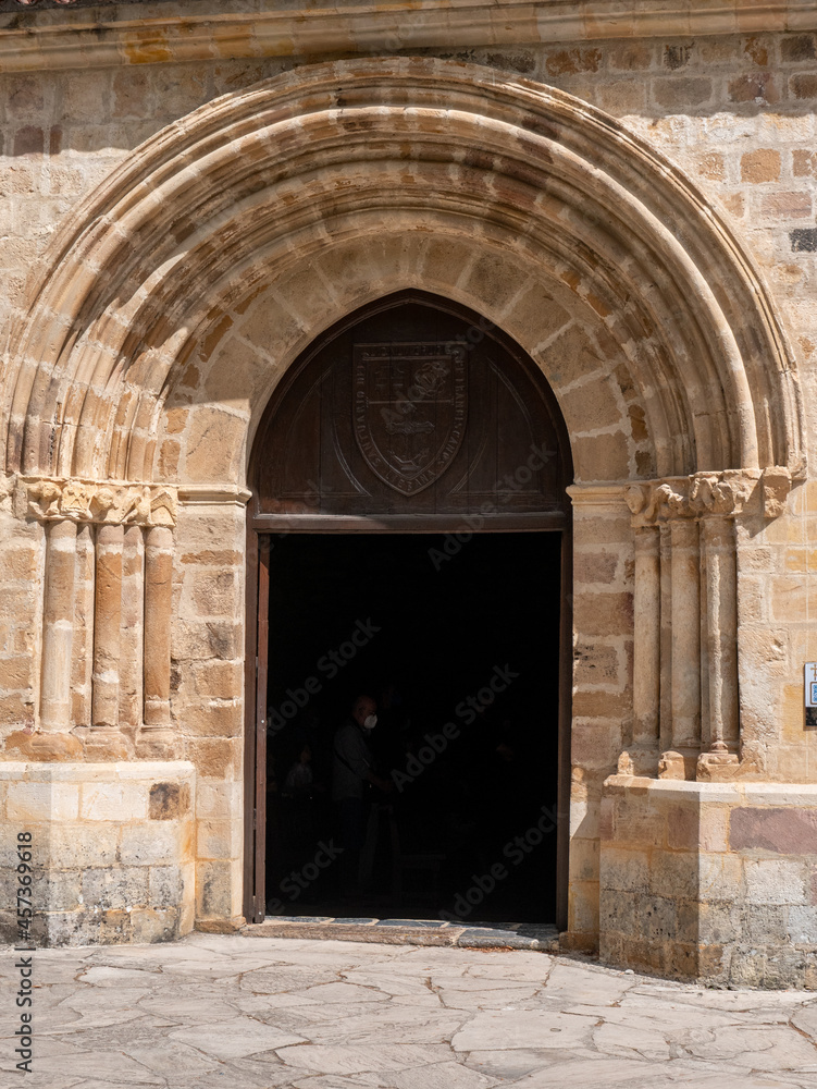 A closeup of the entrance door to a monastery in the mountains of Europe in Spain