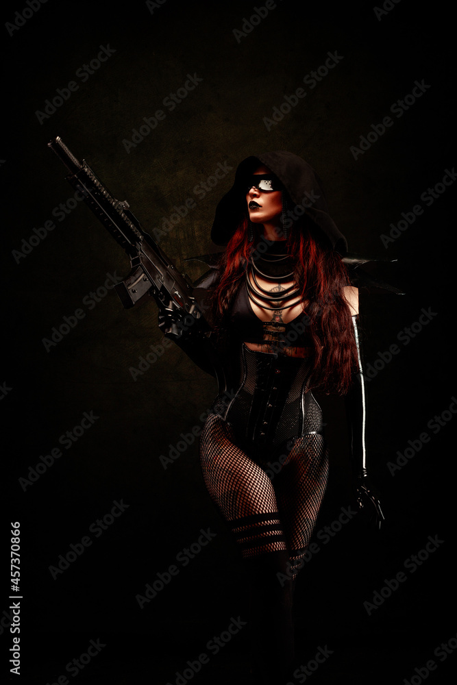 Attractive sexy young woman, armed with an assault rifle, wearing futuristic clothes Attractive sexy young woman, armed with an assault rifle, wearing futuristic clothes