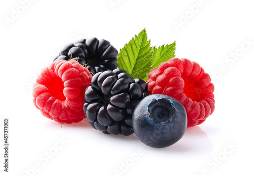 Mix berries with leaves in closeup on white background