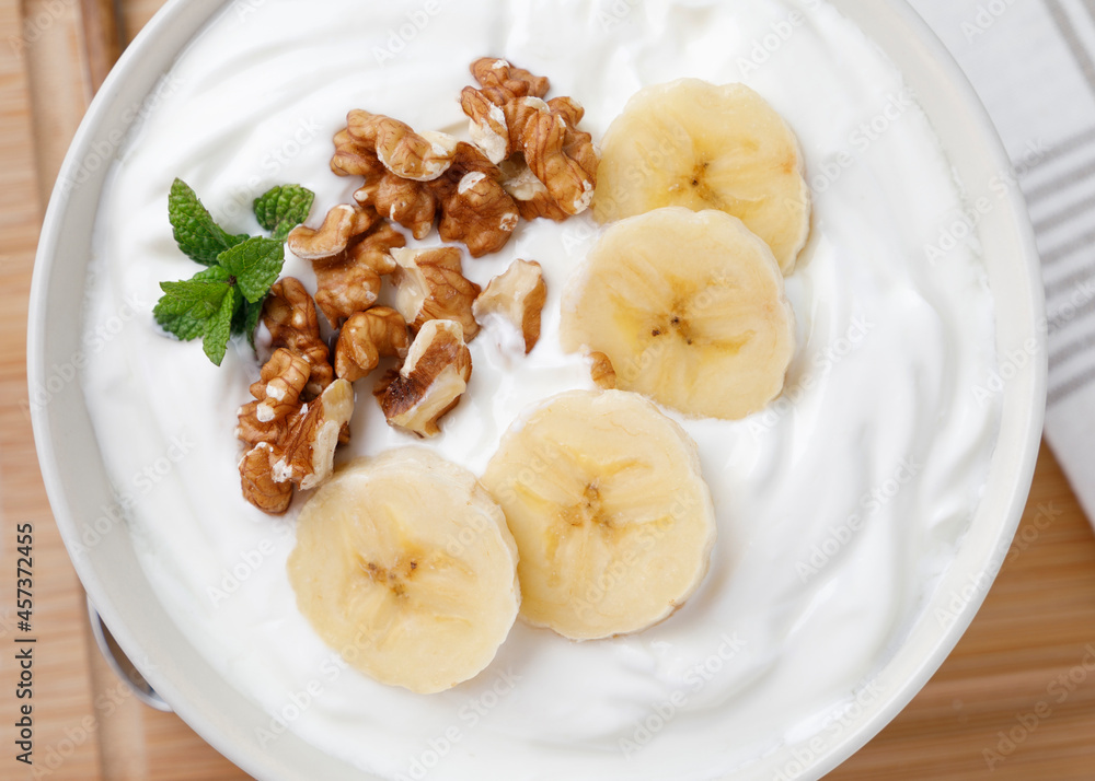 Yogurt breakfast with banana and walnuts Yogurt breakfast with banana and walnuts