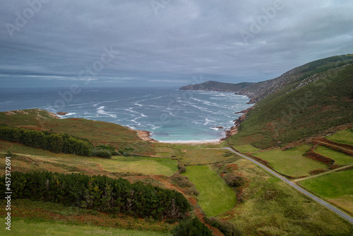 Drone view of a wild beach with green landscape in Galicia, Spain photo