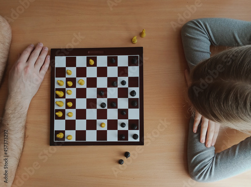 two players are thinking while playing chess top view photo