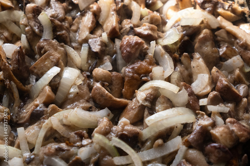 cooking fried mushrooms with onions, stir mushrooms.