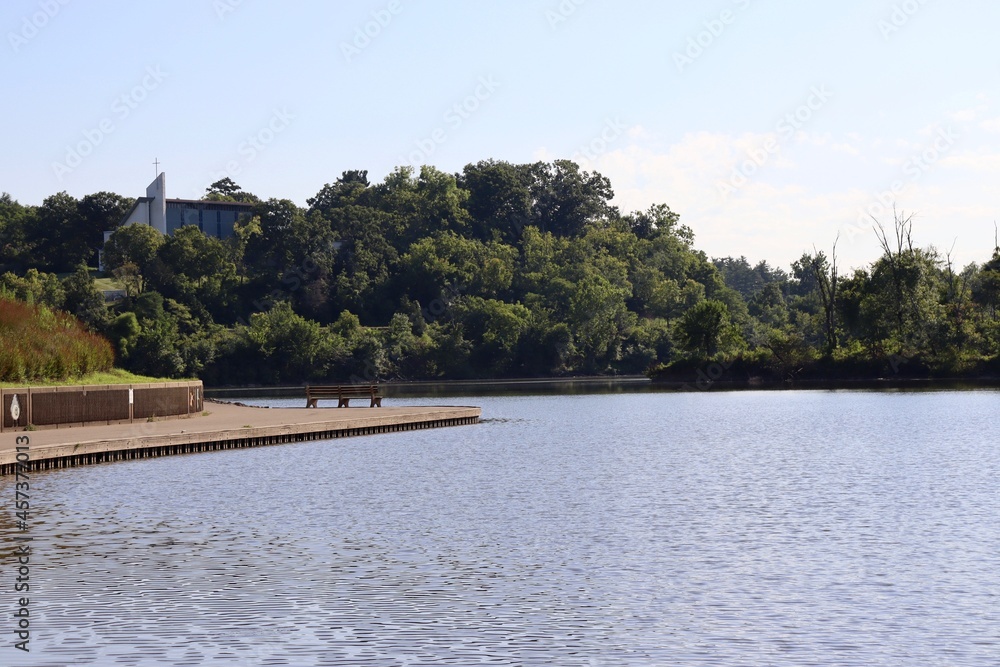 The peaceful scene of the lake on a sunny day.