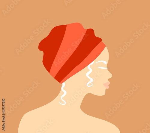 Profile of a beautiful african albino woman in an orange traditional turban  on a soft orange background. Flat vector illustration 