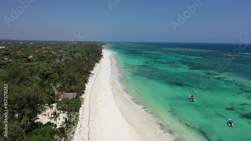 Diani beach Kenyan coast African Sea drone aerial 4k waves blue indan ocean tropical mombasa turquoise white sand East Africa palms paradise view