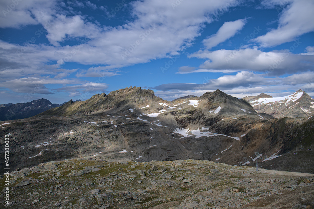 Hiking in Mölltaler Glacier area, high mountains, glacier, waterdams and cows on pastures 