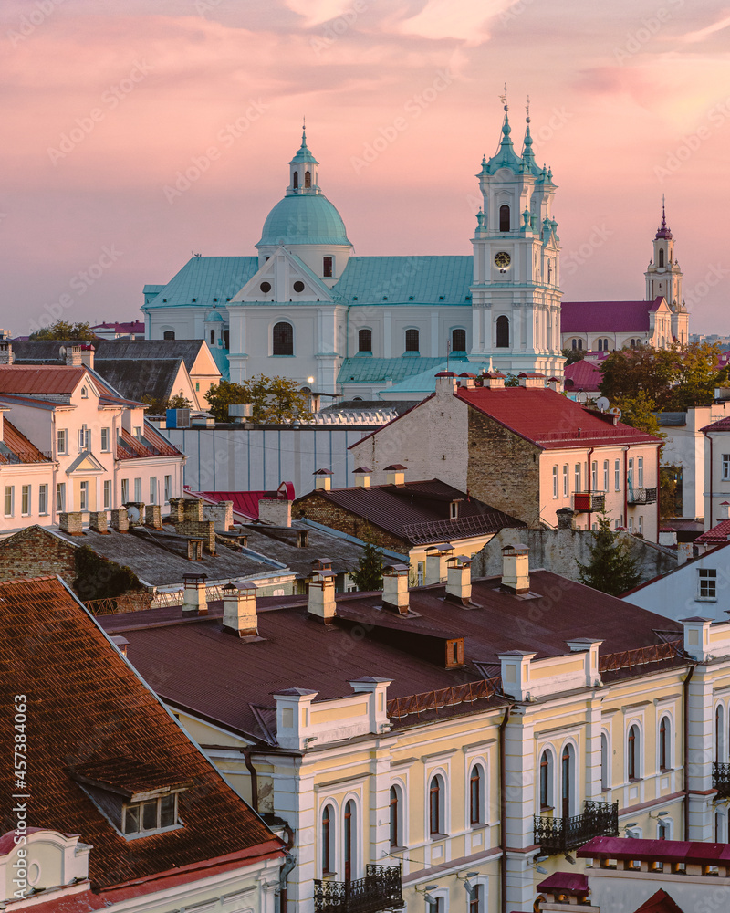 View of the roofs of Grodno and the Orthodox Church in the light of sunset. Grodno is a city in the west of Belarus