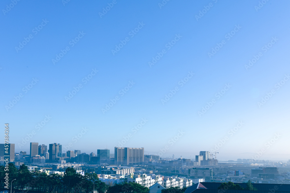 General view of cityscape with multiple modern buildings and skyscrapers in the morning