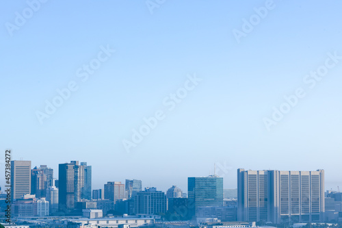General view of cityscape with multiple modern buildings and skyscrapers in the morning