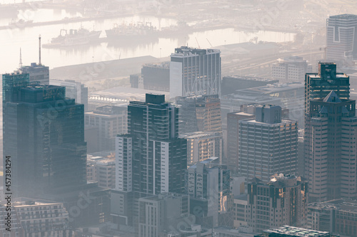 General view of cityscape with multiple modern buildings and skyscrapers in the foggy morning © WavebreakMediaMicro