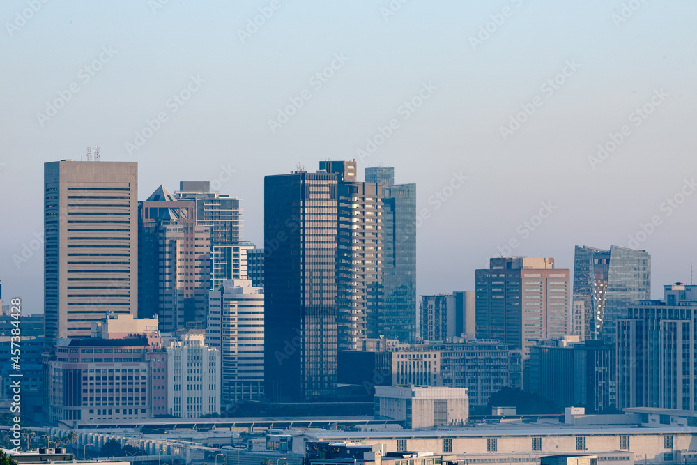 General view of cityscape with multiple modern buildings and skyscrapers in the morning