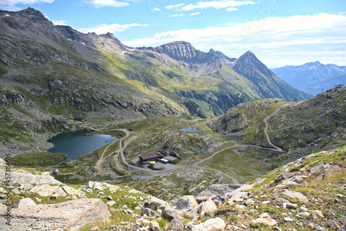 Hiking in Mölltaler Glacier area, high mountains, glacier, waterdams and cows on pastures  photo