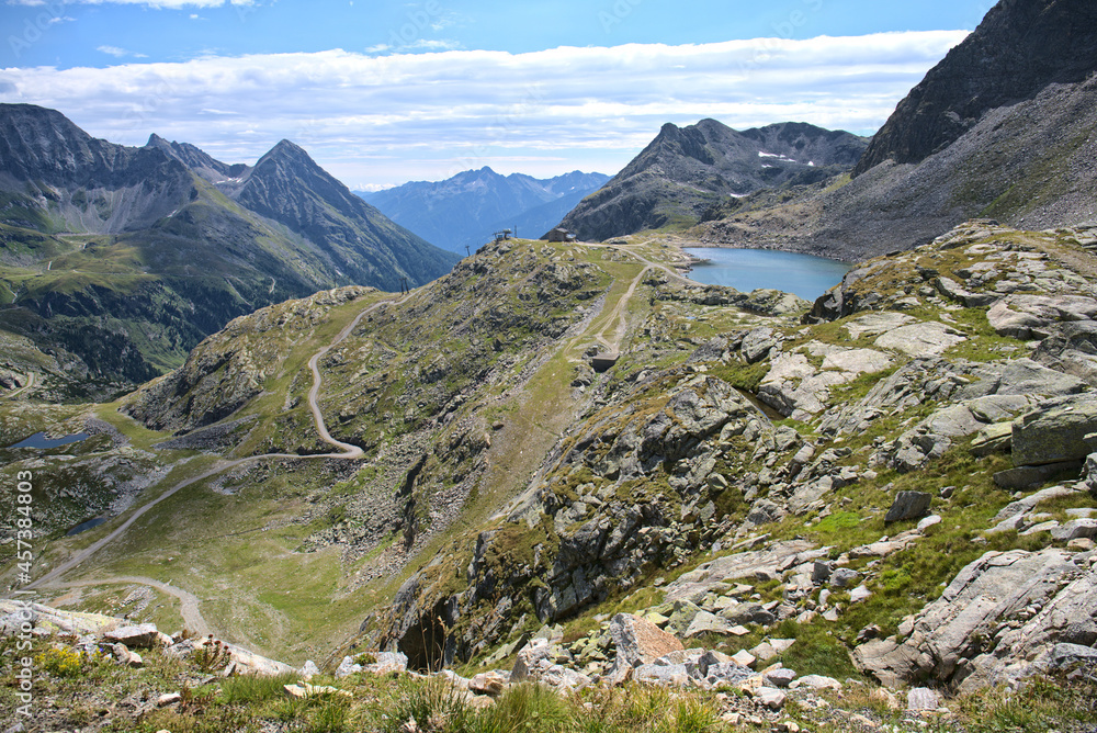 Fototapeta premium Hiking in Mölltaler Glacier area, high mountains, glacier, waterdams and cows on pastures 
