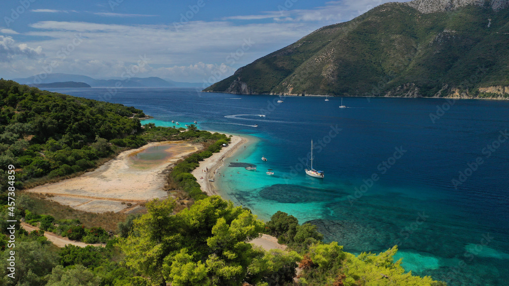 Aerial drone photo of paradise exotic azure beach of Agios Ioannis a famous yacht and sail boat visit in Ionian island of Meganisi, Greece Aerial drone photo of paradise exotic azure beach of Agios Ioannis a famous yacht and sail boat visit in Ionian island of Meganisi, Greece