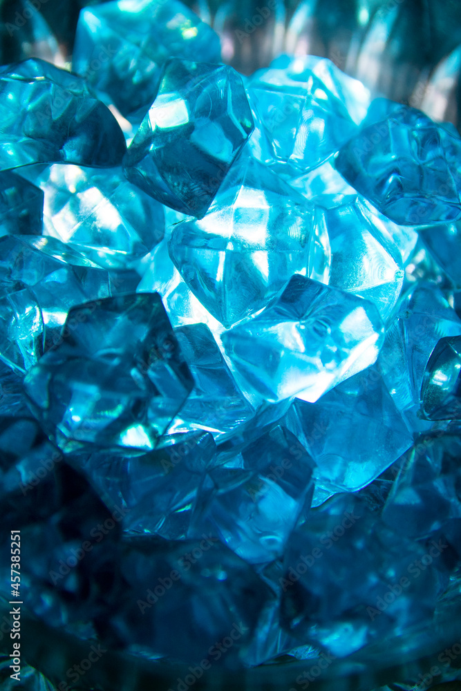Abstraction Blue Crystal Mineral Stone. Close-up of mineral crystals in the rays of light. The texture of glass stones that look like precious stones. Seamless pattern with copy space painted with Abstraction Blue Crystal Mineral Stone. Close-up of mineral crystals in the rays of light. The texture of glass stones that look like precious stones. Seamless pattern with copy space painted with