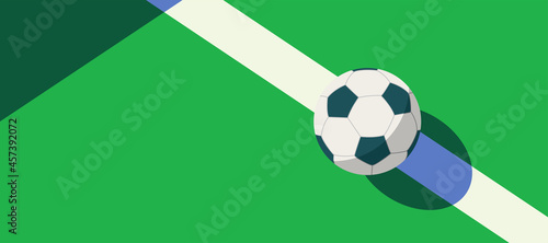 soccer ball standing near the center line on the green field