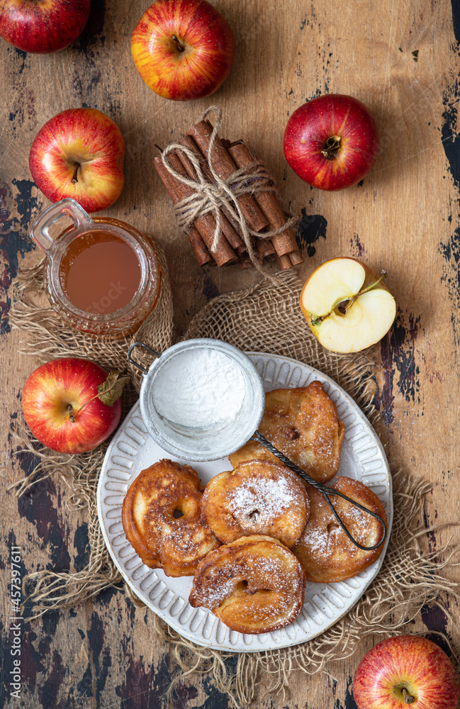 Sweet pancakes with apples, cinnamon and powdered sugar