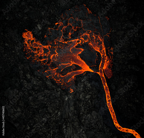 Fototapet Flow of lava on rocky ground