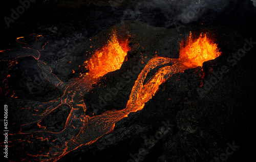 Hot lava flowing in rocky terrain