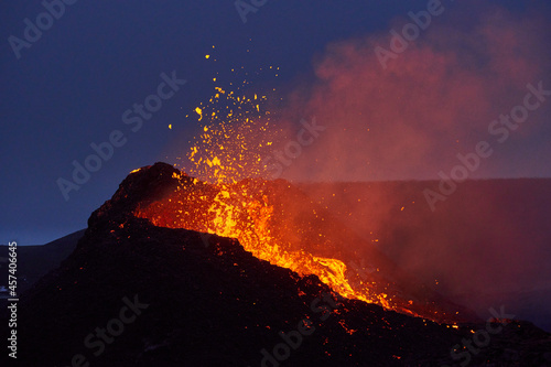 Active erupting volcano at night