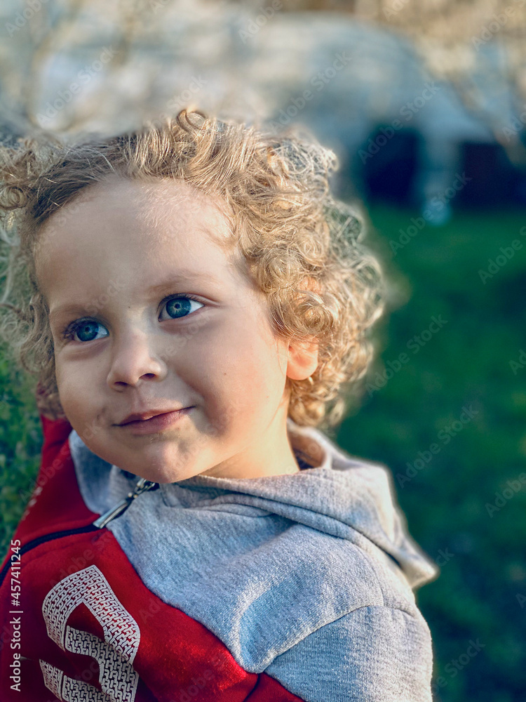 blue-eyed, white, curly-haired boy, close-up blue-eyed, white, curly-haired boy, close-up