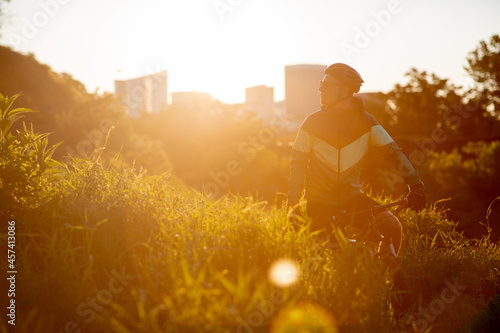 Mountain biker at sunrise with Richmond skyline in the background. photo