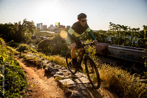 Mountain biker at sunrise with Richmond skyline in the background. photo