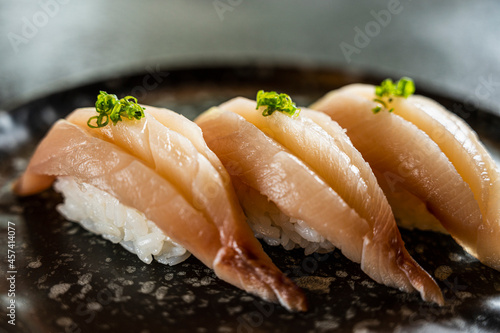 Hamachi sushi at sushi bar in Northern Thailand photo