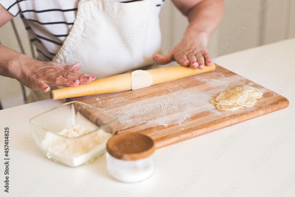 A woman cooks Russian dumplings, hands close-up, step-by-step recipe. A woman cooks Russian dumplings, hands close-up, step-by-step recipe.
