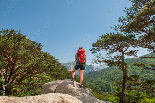 woman hiking towards Ulsanbawi at Seoraksan national park photo